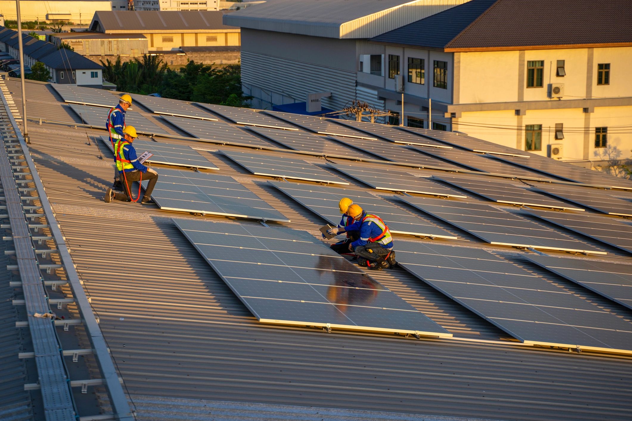 Team installing solar panels on a commercial rooftop